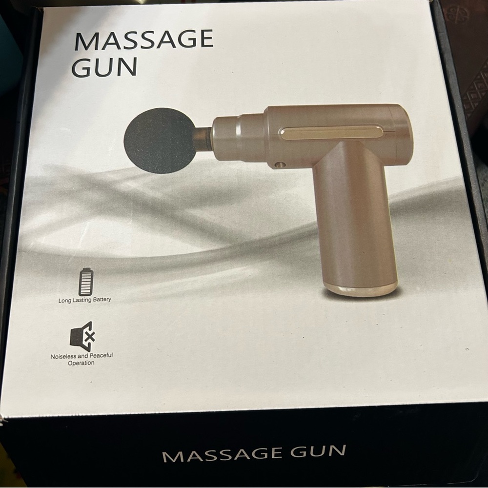 Compact Massage Gun in Metallic Beige with Black Attachment